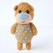 Light brown bear with blue polka dotts
