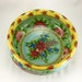 Yellow porcelain serving bowl with excentuated lip