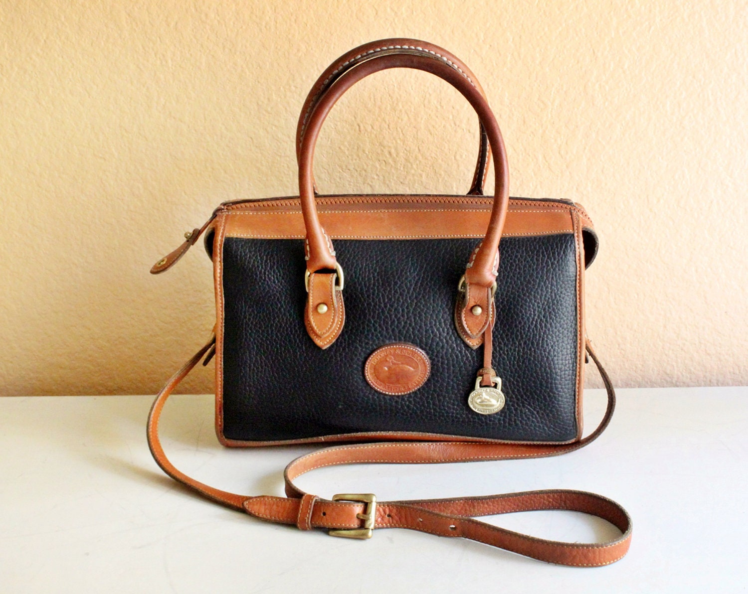 Dooney and Bourke Black Pebble Leather With Tan Leather Trim