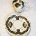 Gold Black Ivory Pedestal Tea Cup and Saucer Demitasse Ucagco /