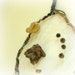 Baby mobile dreamcatcher white weave with tree bark, natural pods, beads, metallic bell and a large feather