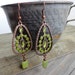 Copper colored dangle earrings with Natural Peridot green boho