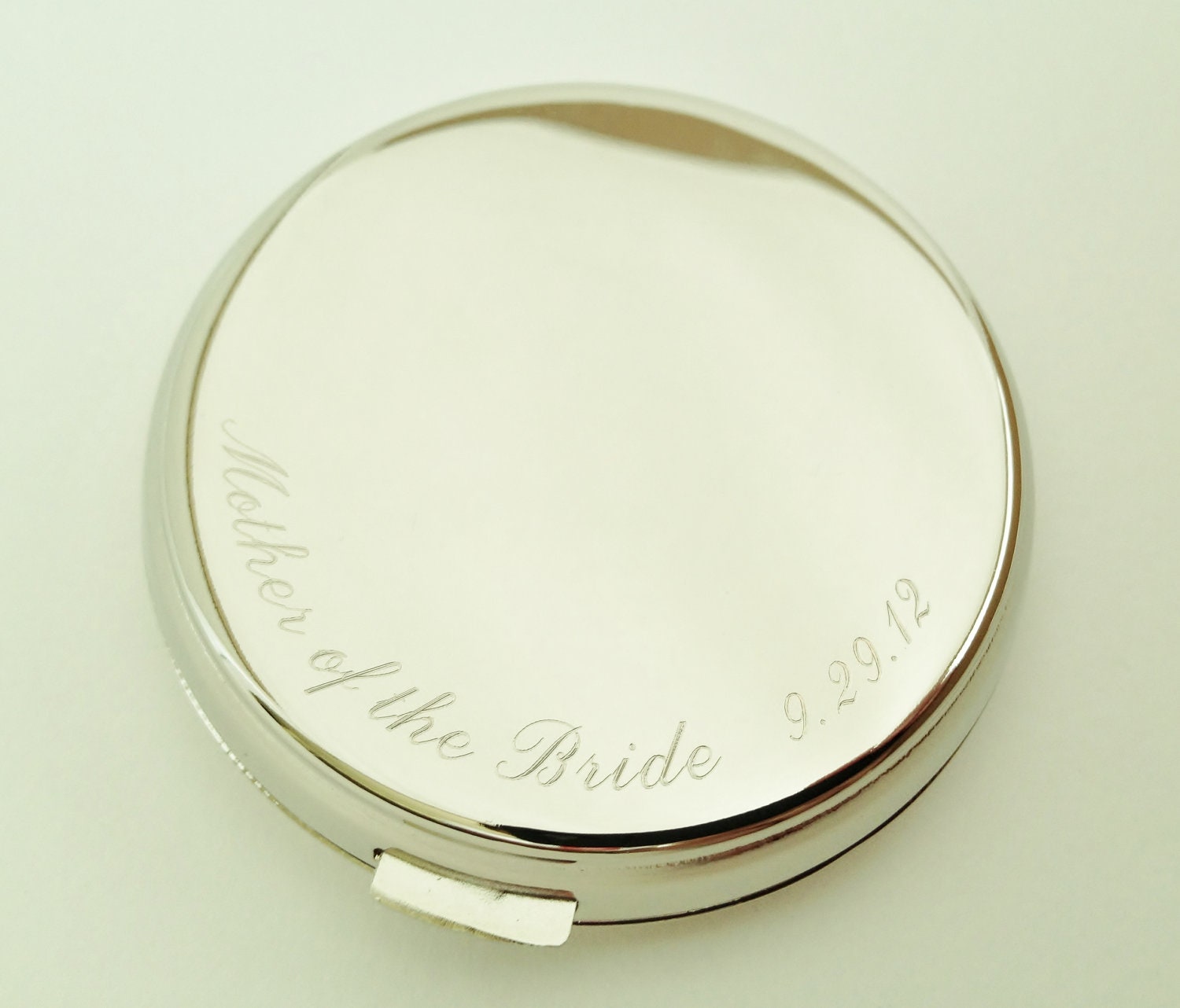 Engraved compact