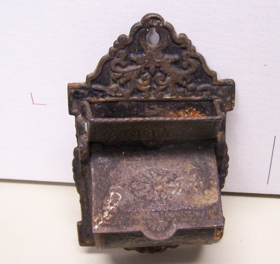 Vintage cast iron match holder