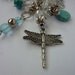 Silver tone charm-style pendant with dragonfly charm and 6 aqua/blue removable knitting stitch markers