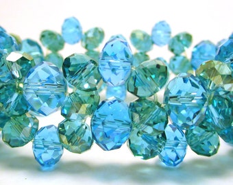 Crysal bracelet, 6mm and 5mm aqua blue crystals with 5mm aqua green crystals with an AB finish on a stretchy cord