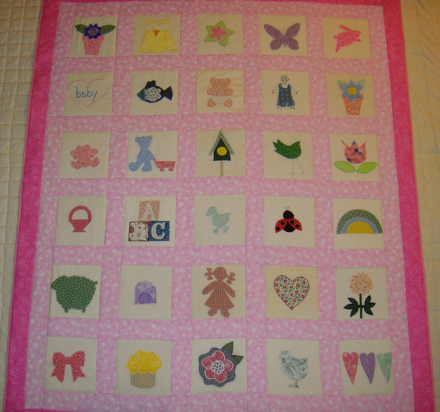 Light pink on dark pink baby quilt