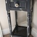 Custom hand painted, hand distressed small cane bottom wood dresser.