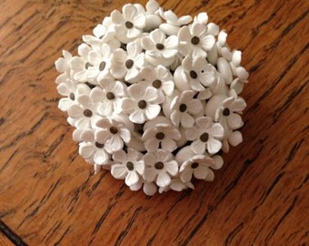 60's white plastic pin West Germany