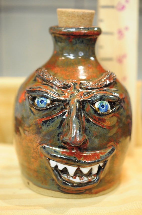Stoneware Pottery Ugly Face Jug. 6 tall to top of