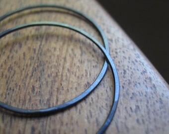 black earrings. black hoops in niobium wire. Made in Canada.