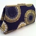 gold and blue clutch