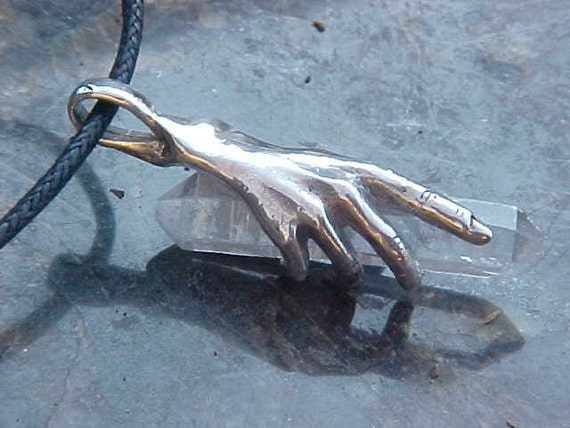 HAND Holding Terminated QUARTZ Crystal in a KAM Custom