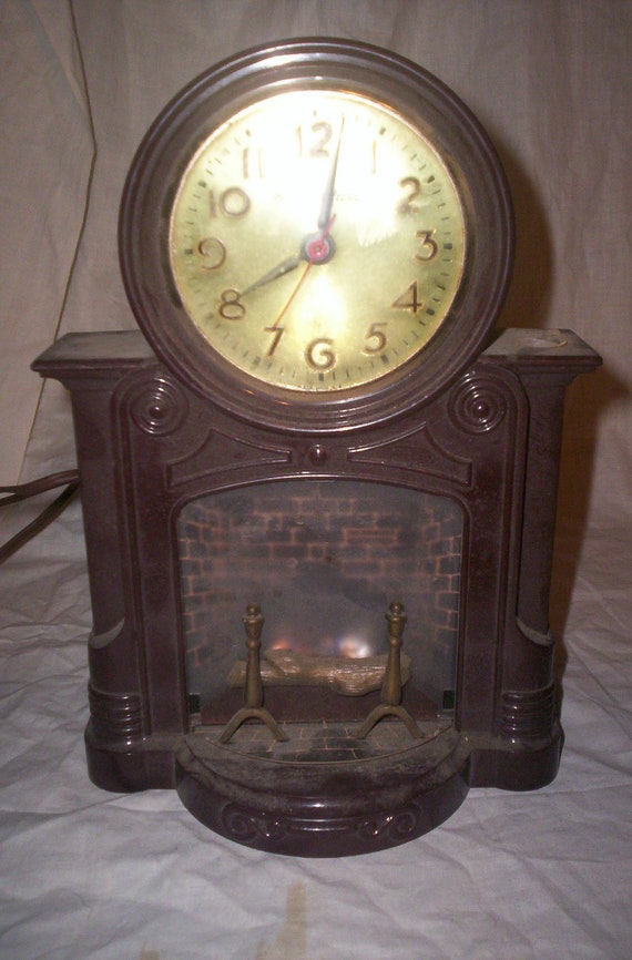 vintage mastercrafters motion clock fireplace