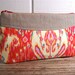 Linen wristlet made with red Amy Butler fabric and linen.