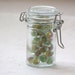 Small Glass Jar with Bail Clamp Filled With Vintage Mini Peewee Cats Eye Marbles