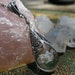 Spring fashion 2013, Artisan Jewelry, Quartz encased in Hand Blown Glass, Antiqued Silver Filigree with a Swarovski crystal accent.