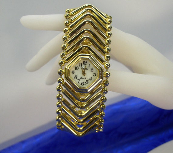 Xanadu Gold Tone Wide Chevron Ladies Watch