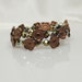 Green Crystal Bracelet with Bronze Flowers