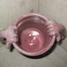 goatse mug with sickly pink glaze