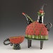 Red teapot with green pants