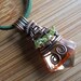 Wire Wrapped Pendant Golden Light Orange Cubic Zirconia Faceted Drop with Green Peridot beads in Oxidized Copper wire
