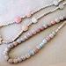 6 StrandsTerra Cotta beads with Flower and Cross pendants from Mexico