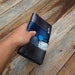 Ladies wallet clutch made from reclaimed seat belts and bicycle inner tube
