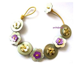 Bracelet button jewelry made of shell flowers buttons on yellow leather cord