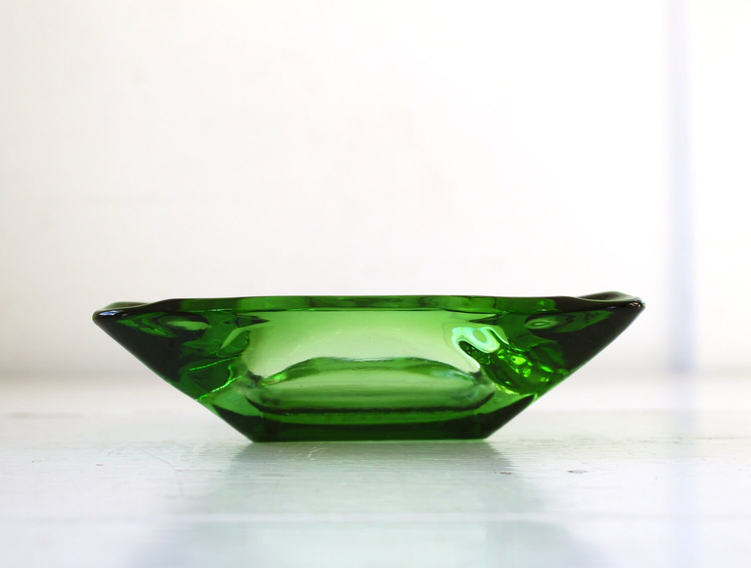 Sale / vintage 1970s emerald ashtray. Green glass. Retro mod
