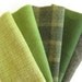 Hand dyed felted wool in a combination of five green tones in a 15" x 8" size