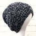 Black sparkly beanie, slouchy hat, oversized winter accessory.