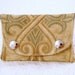 Fold over coin purse in recycled tapestry fabric.