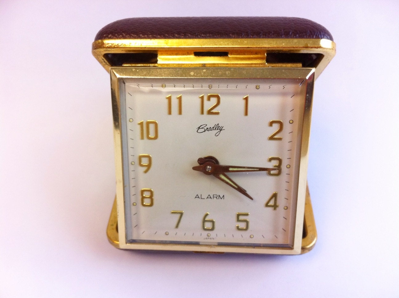 Vintage Bradley travel alarm clock. Brown case. Works.