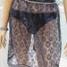 Black lace, half apron, hostess style, trimmed with silver rick rack and black satin waist and ties