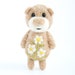 Light brown pocket bear with camomiles