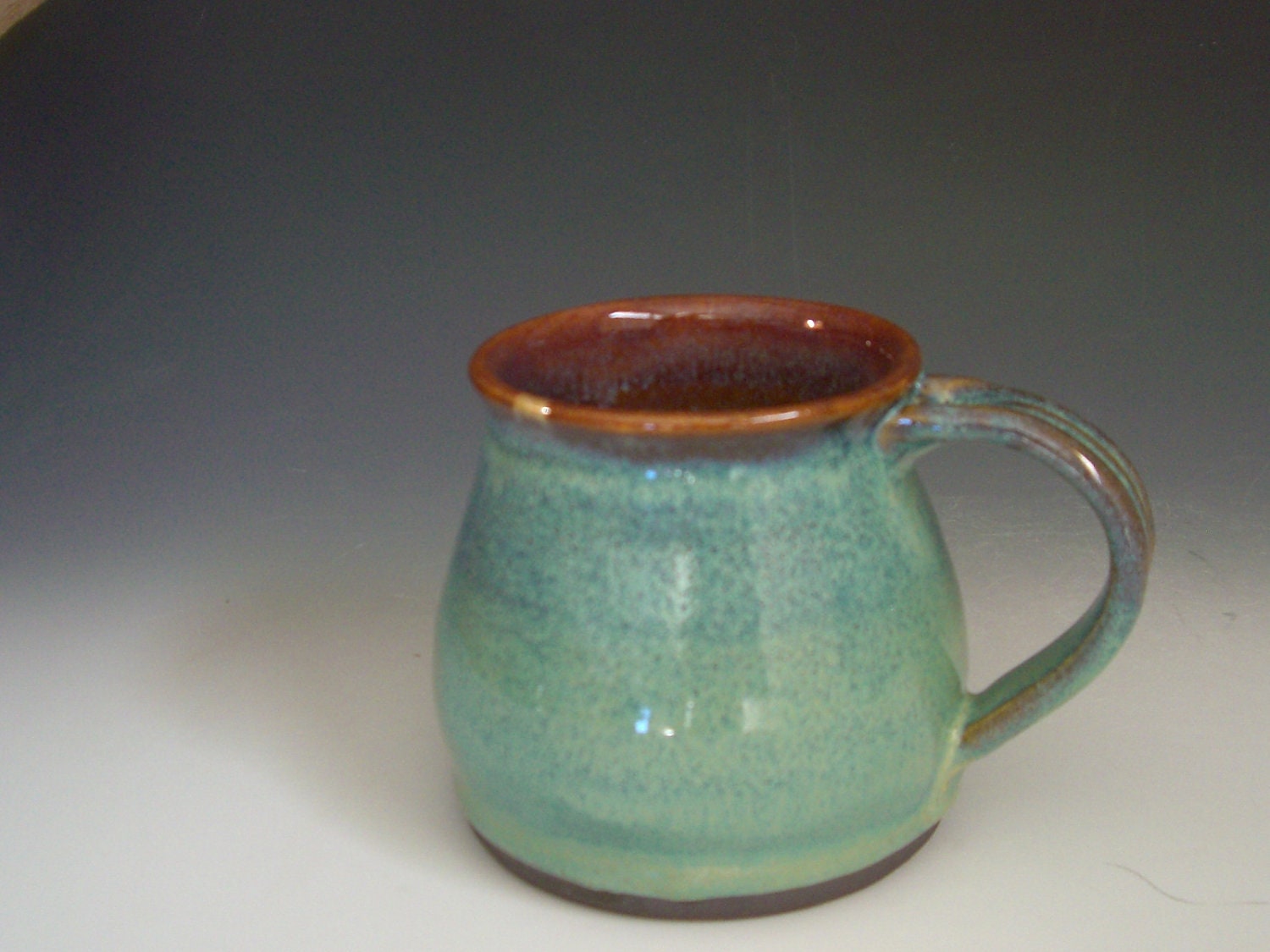 Hand thrown stoneware pottery travelers mug