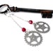 Steampunk Gear Earrings Silver Gear Long Dangle Earrings with Cherry Red Crystal Accent by Compass Rose Design
