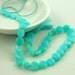 Blue peruvian opal coin beads 9mm 1/4 strand