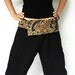 blue flower with brown sarong on waist and black cotton thai fisherman capri pants 2 tone