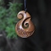 Bone Koru hook. Hand carved & naturally stained