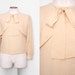 Oleg Cassini Tie Neck Silk Blouse with Geometric Texture Size Small 1980s Vintage