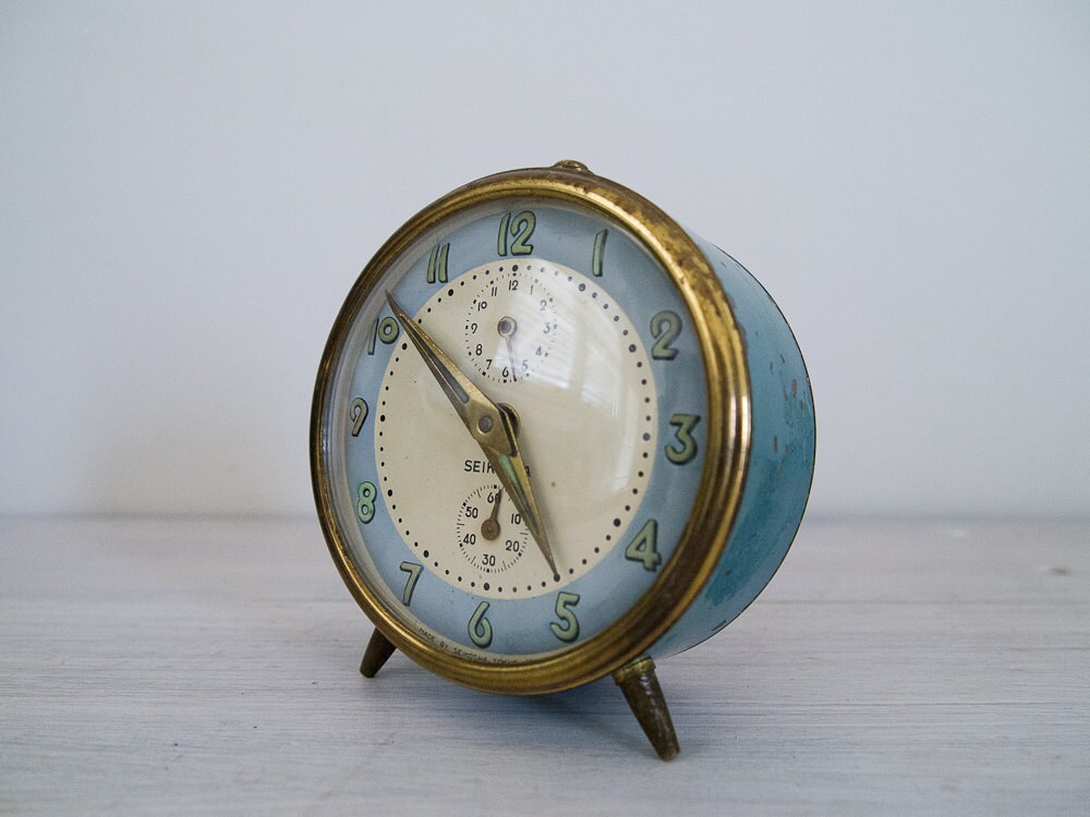 vintage teal and brass japanese alarm clock