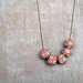 Polymer clay necklace - Rusted orange - Flowers
