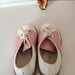 pink and white saddle shoes