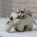 Collector of marine snails, needle felted creature