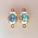 2 Aurore Boreale 10x8mm Swarovski foil backed Oval Rhinestons in 2 loop brass setting