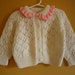 Vintage handknit pointelle cardigan sweater, pink ruffles / bunny buttons / Size 18 to 24 months