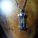 Hourglass pendant with black sand necklace by vintagerust