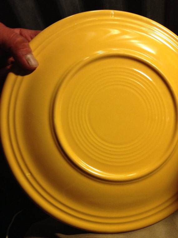 Original unmarked fiestaware dinner plate in yellow